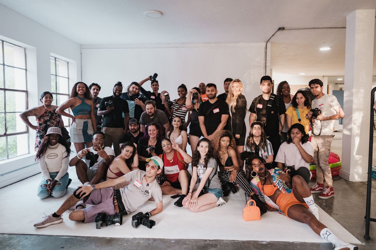 Members of the studio collaborating around a table